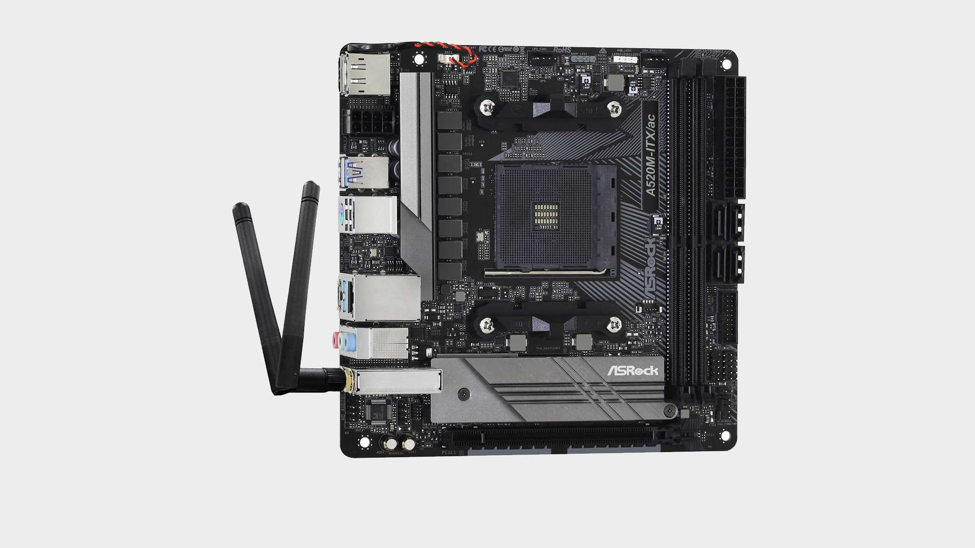 Image of the ASRock A520M ITX/ac motherboard top down on grey.
