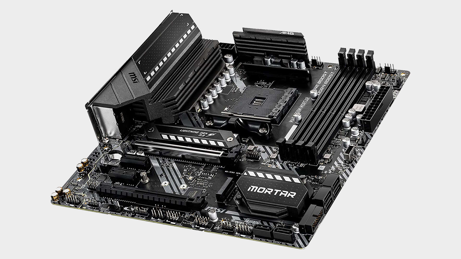 Image of the MSI MAG B550M Mortar motherboard from side-on on a grey background.