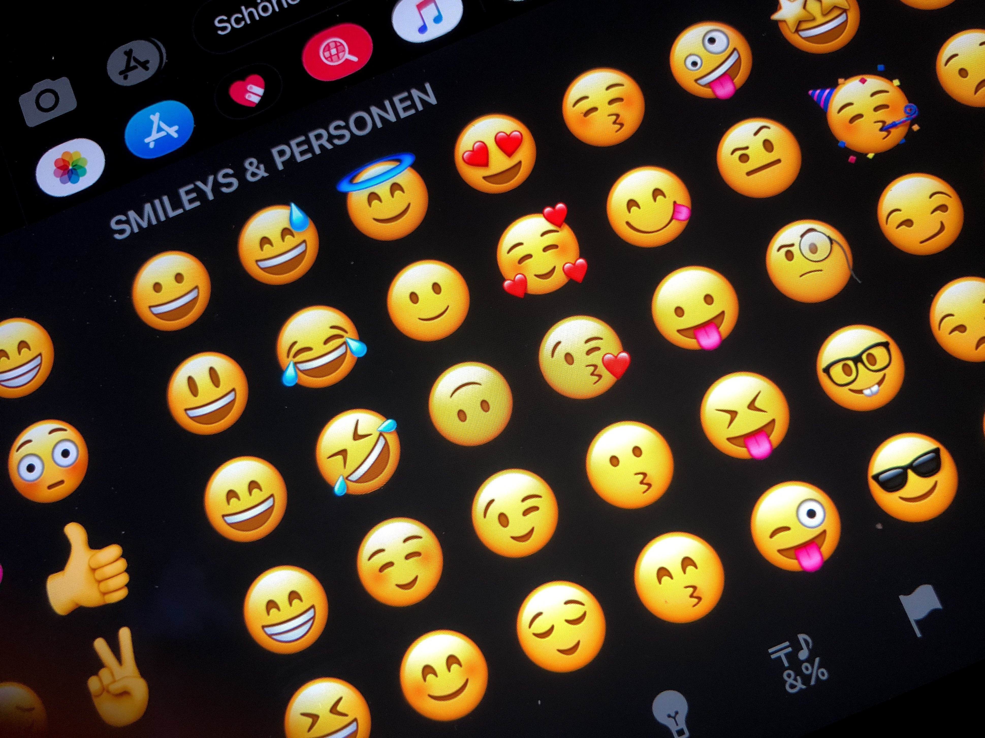 A screen showing various iOS emoji