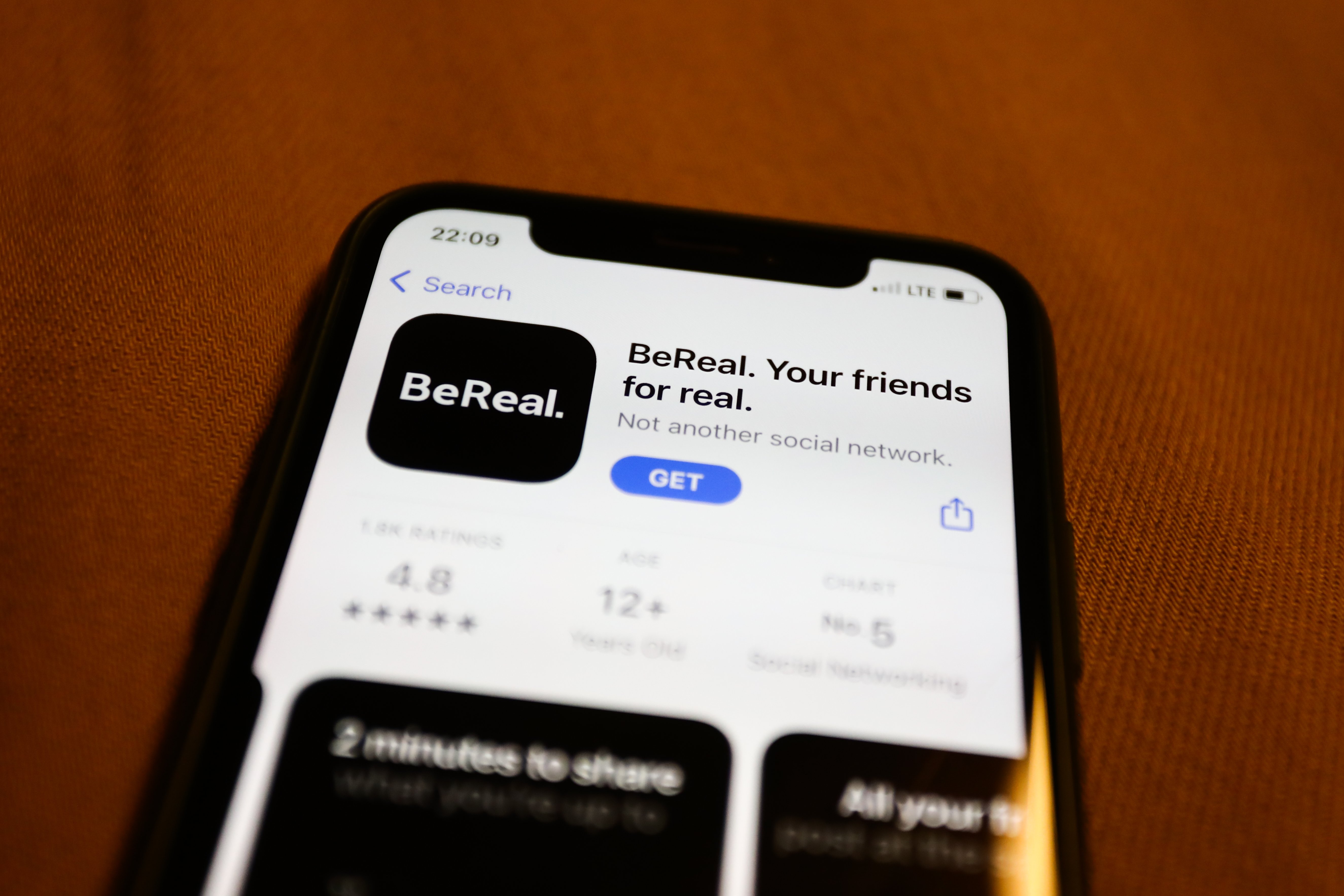 BeReal on the App Store displayed on a phone screen