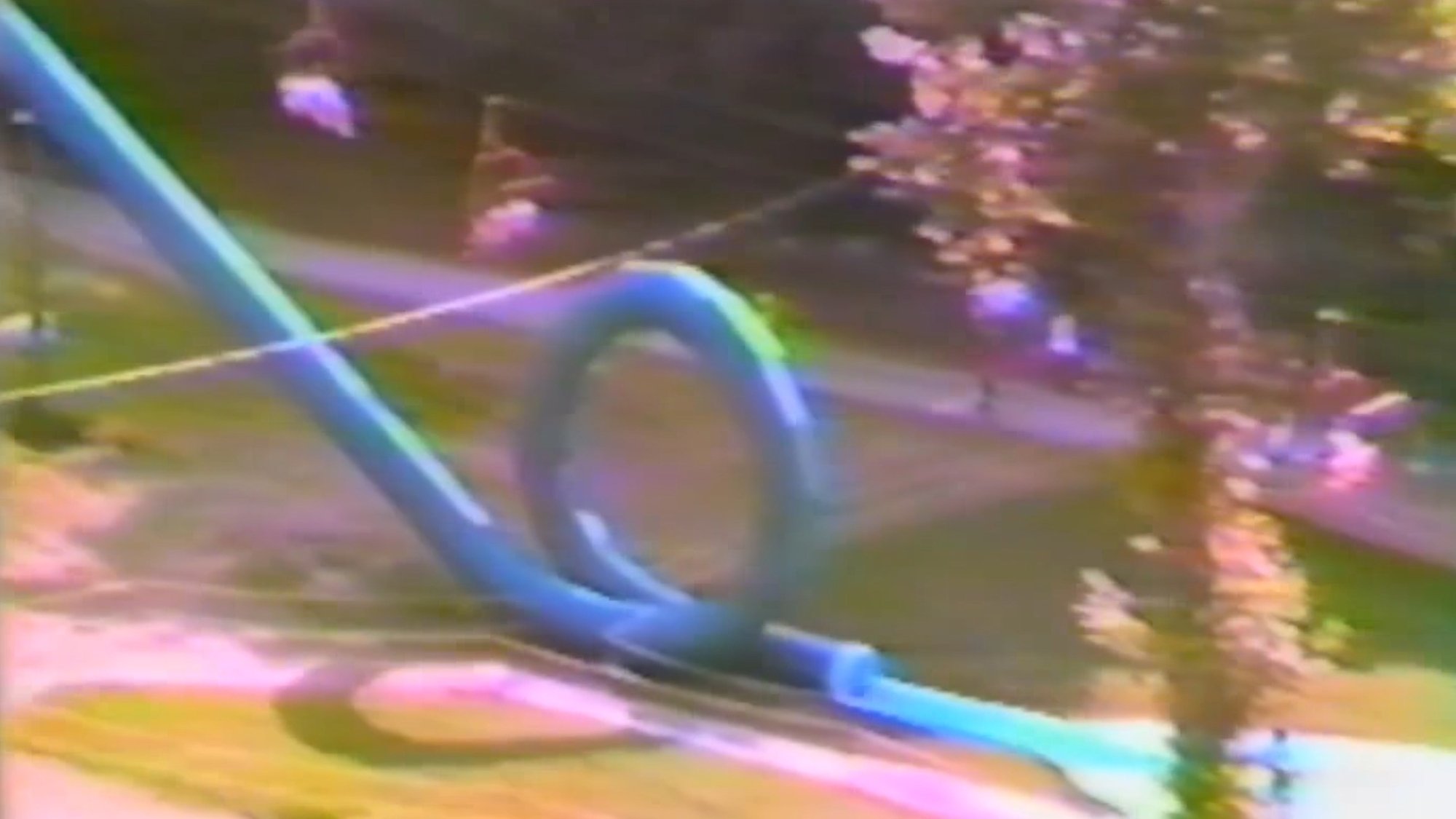 A blue water slide that goes in a loop the loop