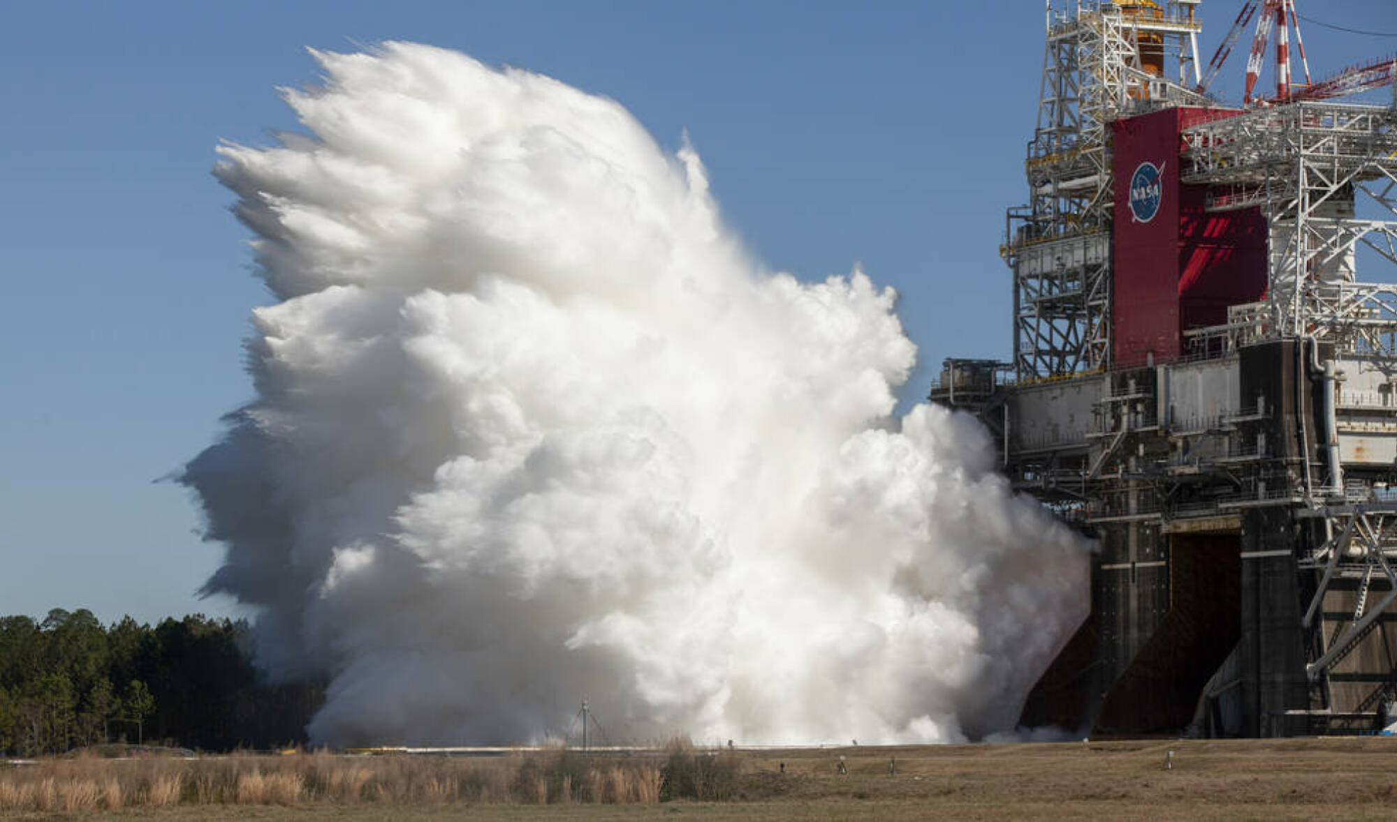 the SLS rocket's four main engines firing in a thrust test