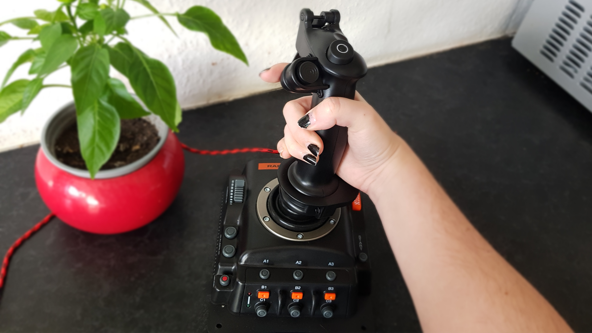 The FR-Tec Raptor Mach 2 in hand with plant