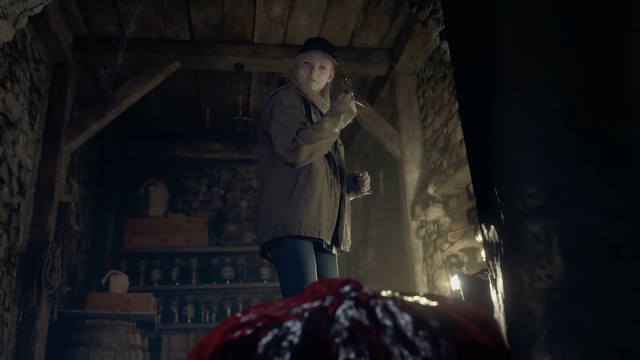 a girl with blonde hair, in a dark room, looks down at a bubbling pile of blood that appears to be transforming into a human shape