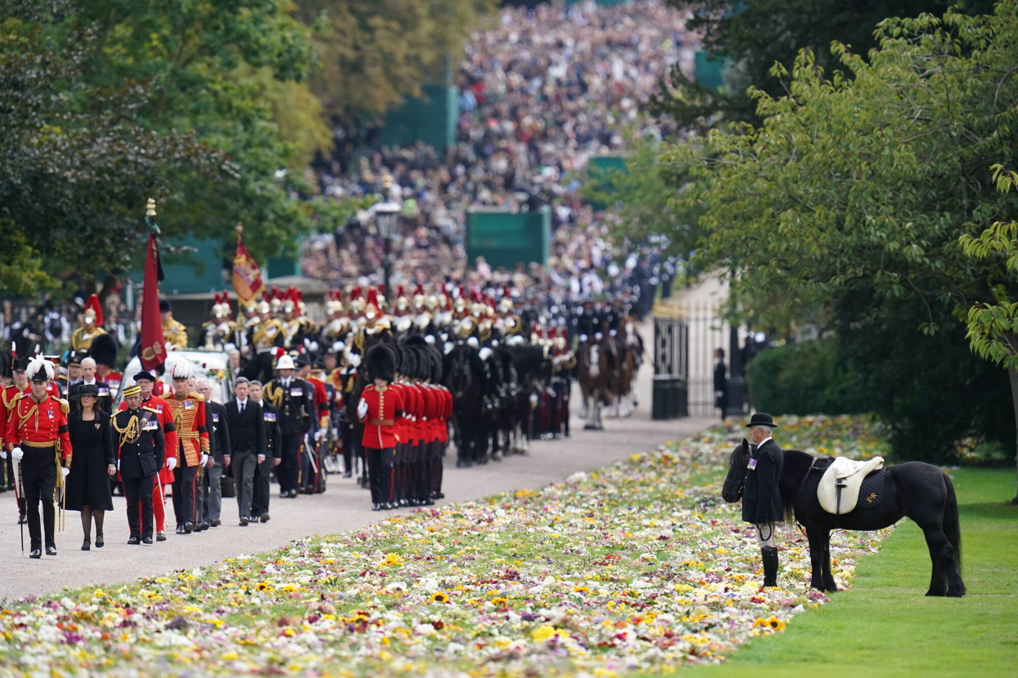 The funeral procession for Queen Elizabeth II making its way to Windsor Castle.