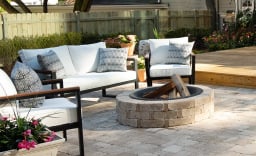 backyard fire pit surrounded by couches