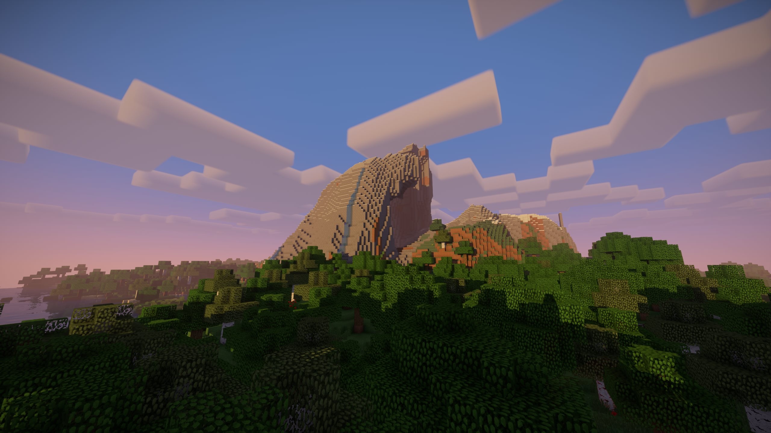 Minecraft shaders - vanilla plus, a forested mountain at sunset casting shadows