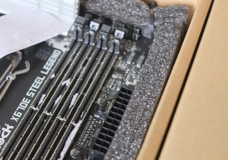Asrock will send you a replacement motherboard if you can’t get the stickers out of your DIMM sockets