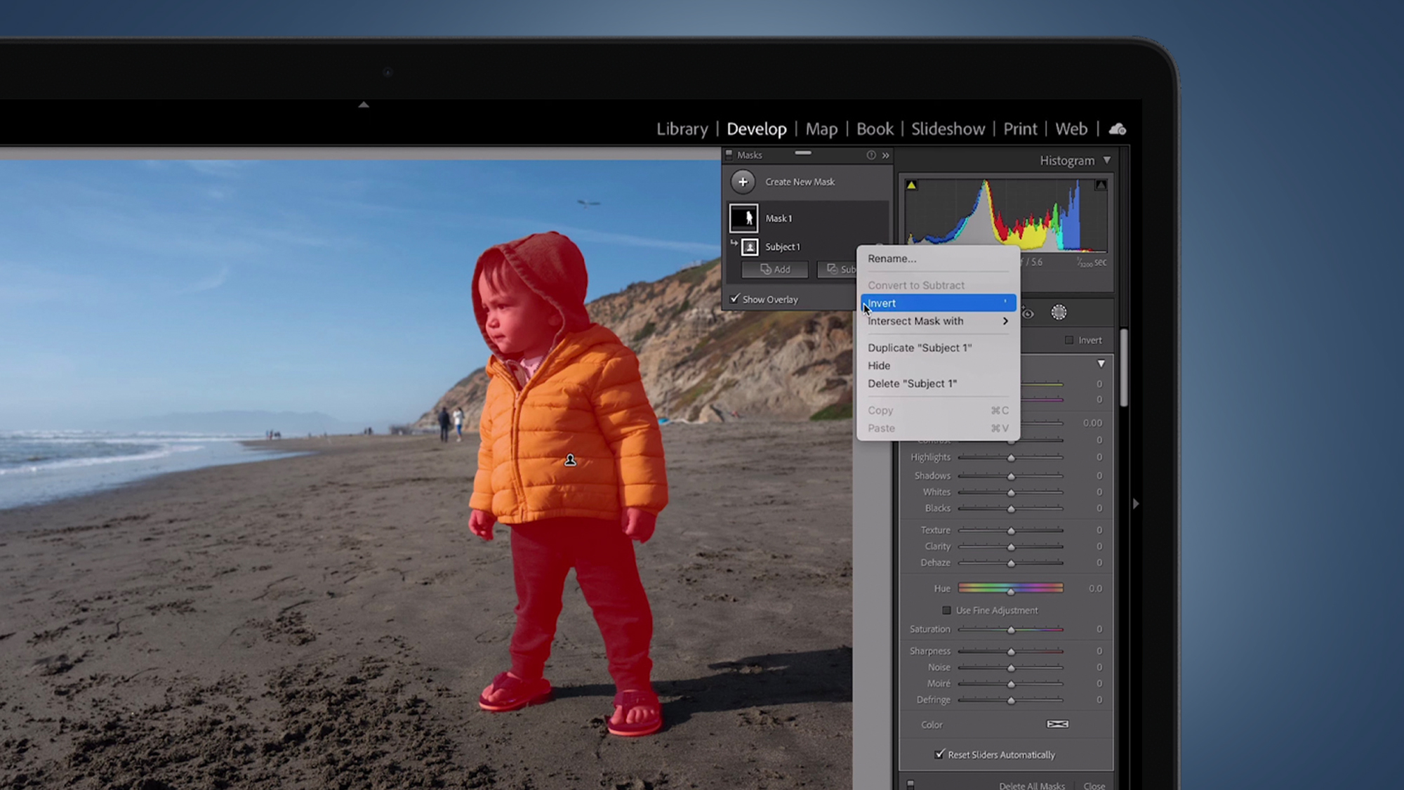 A photo of a child being edited in Adobe Lightroom