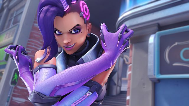 Sombra poses with a grin on the Toronto map in Overwatch 2