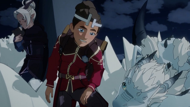 ezran, a boy wearing a crown on his curly hair, sits atop a dragon, a smaller dragon is next to him