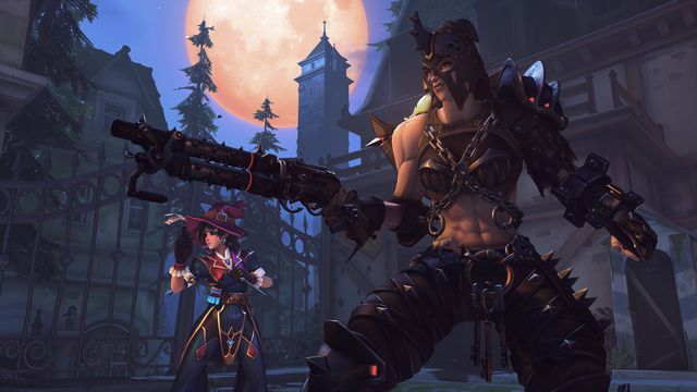Junker Queen in her Executioner skin and Kiriko in her Witch skin stand ready to fight in a moonlit scene set on the Eichenwalde map, which is Halloween-themed for Overwatch 2’s Halloween Terror event.