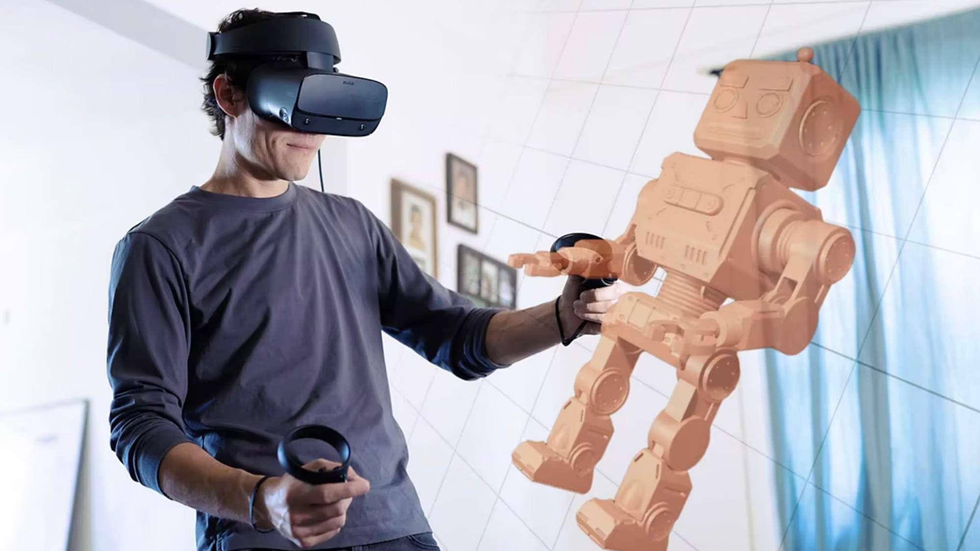 A man wearing a VR headset designing a robot