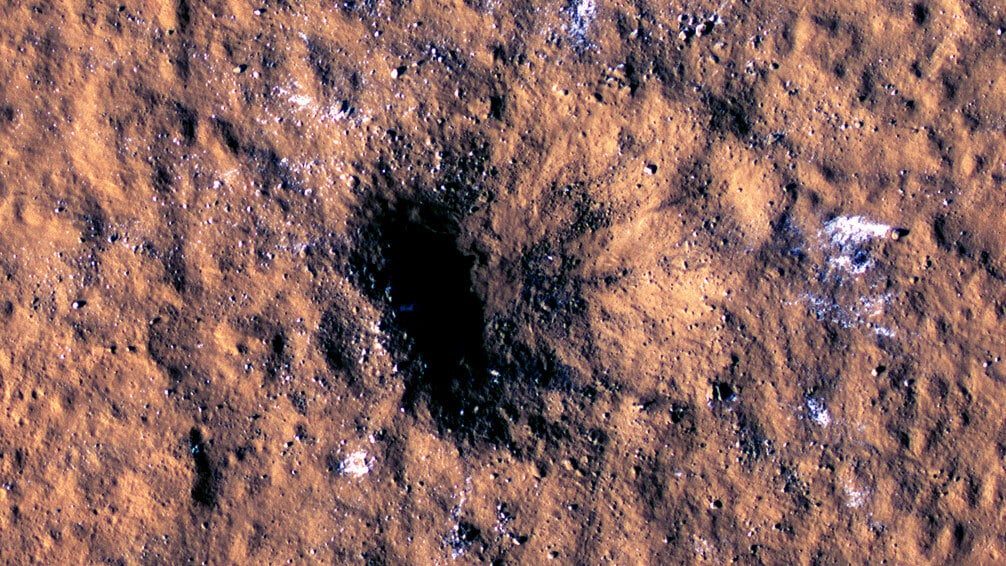 Martian crater exposing underground ice