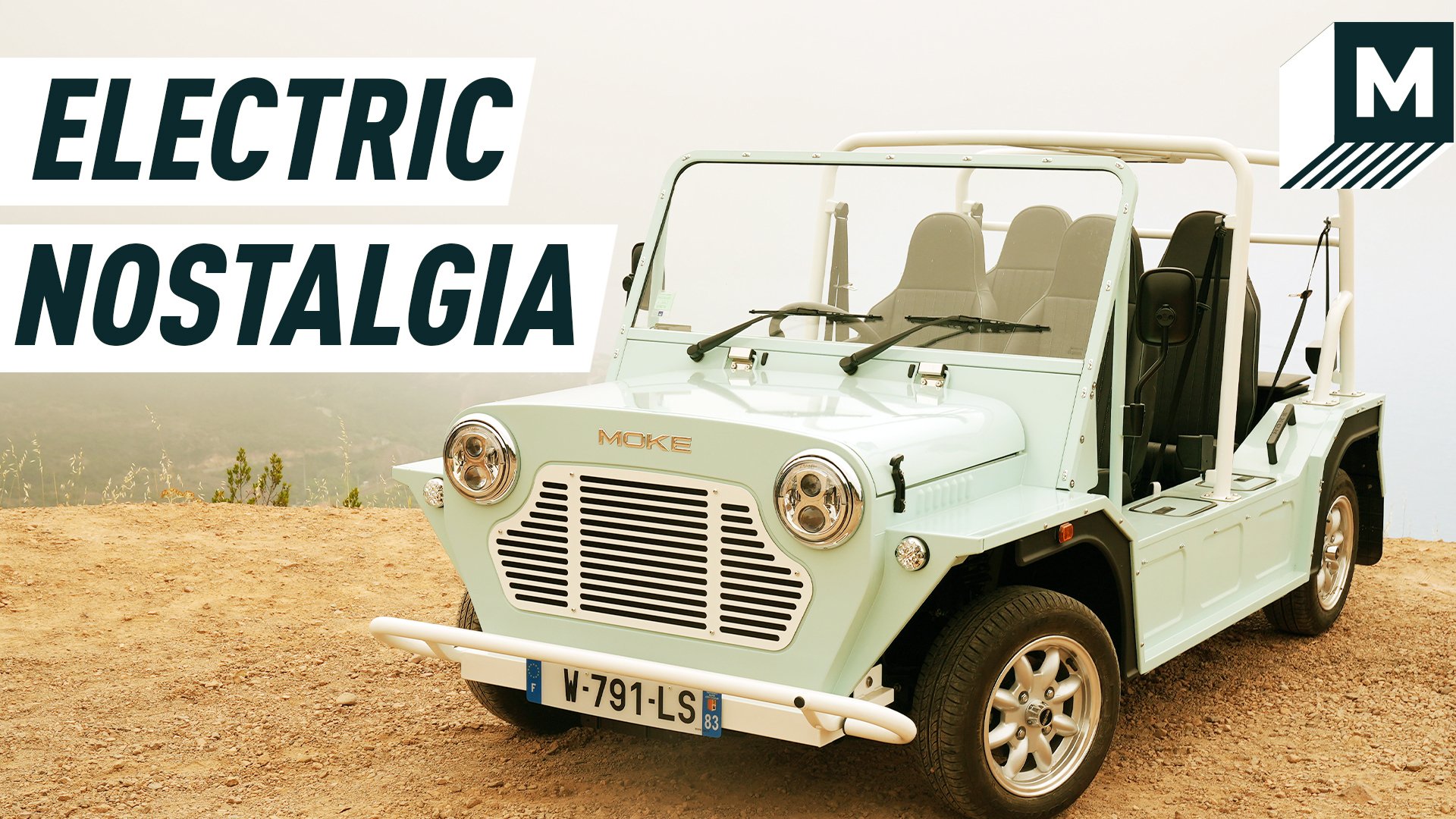 An image portraying a mint-coloured e-Moke parked on a cliff. Caption reads: 