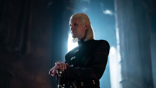 Matt Smith as Prince Daemon Targaryen standing with his hands folded atop a cane in House of the Dragon