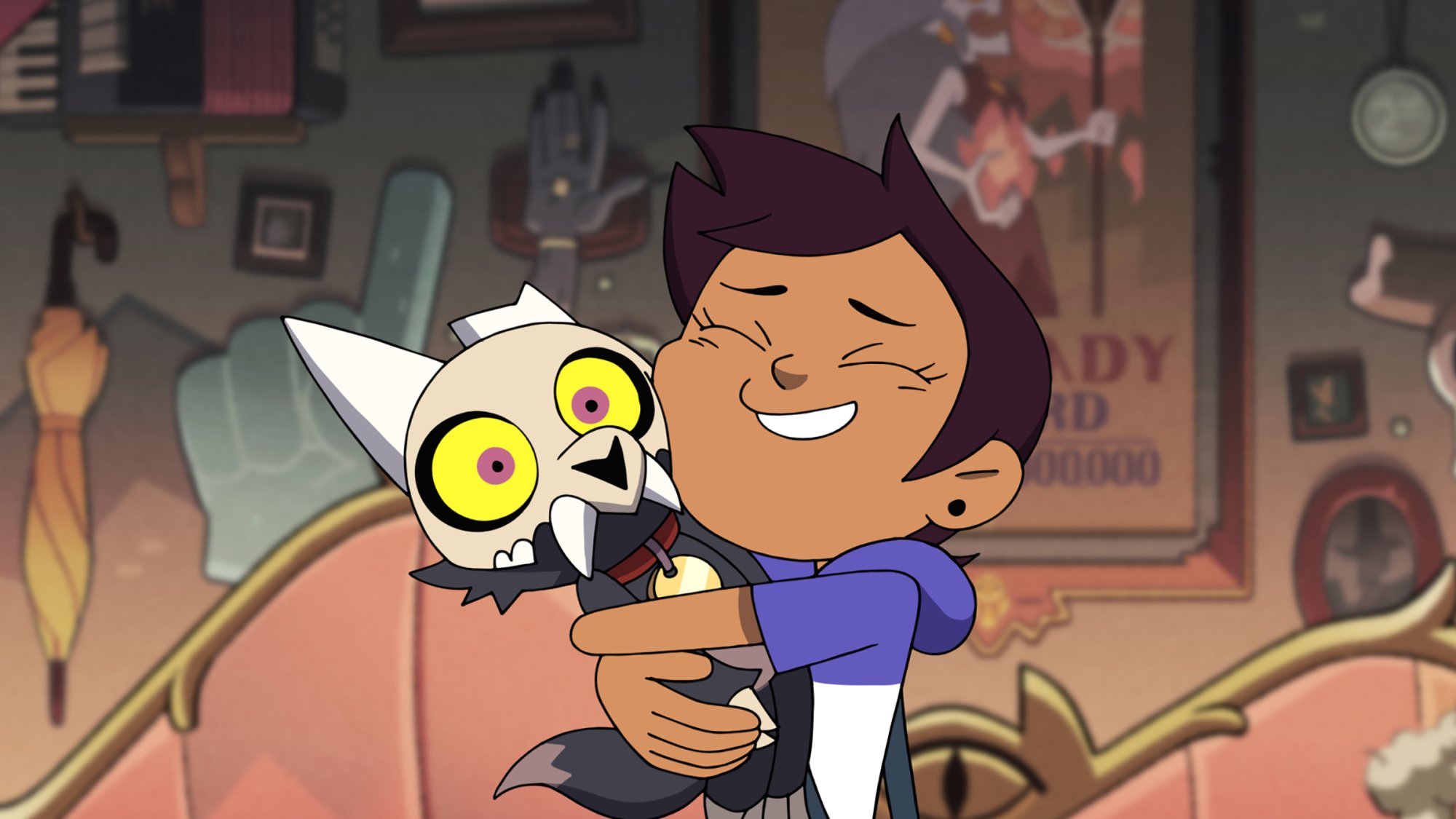 A cartoon girl with short brown hair tightly hugs a cat-like creature wearing a fanged mask.