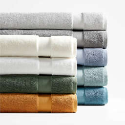 Folded towels in jewel tones, gray, blue, and white