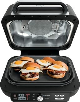 ninja foodi grill combo with breakfast sandwiches on griddle