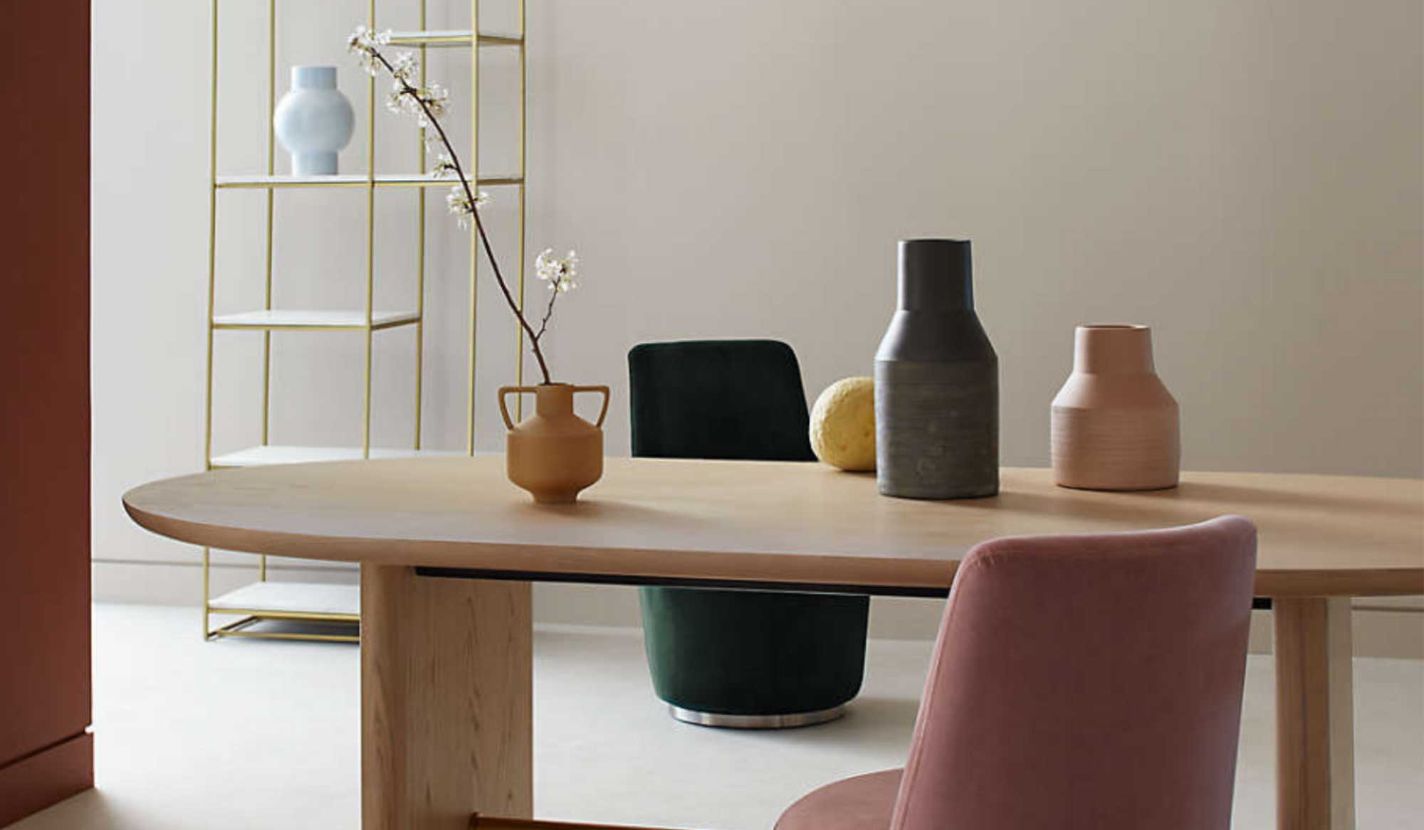 A table, colorful chairs and vases, and a shelf
