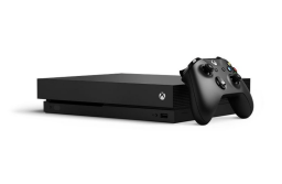 Black Microsoft One X console with controller