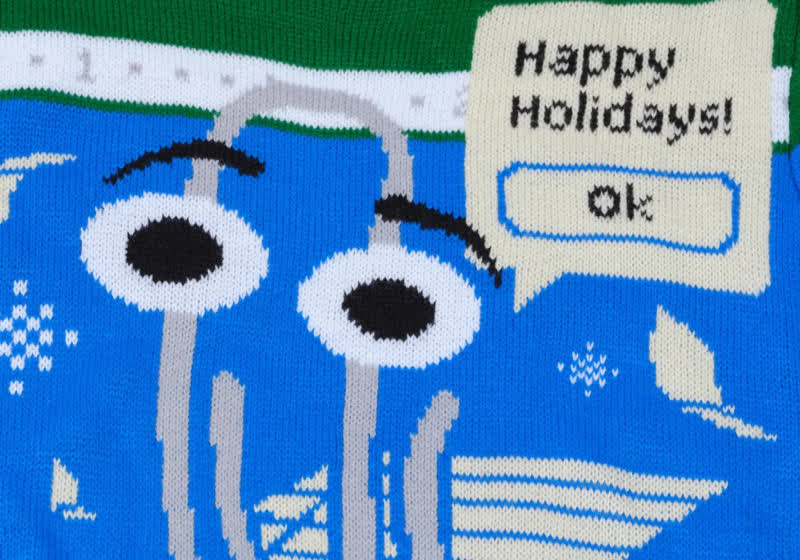 Celebrate the holidays in style with this Clippy ugly sweater