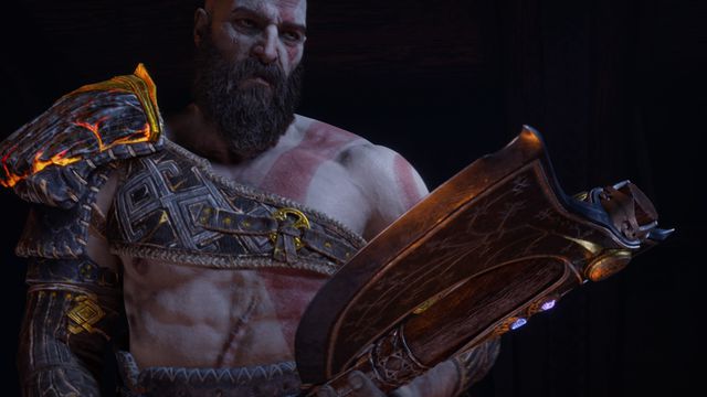 Kratos gazes at the Leviathan Axe in God of War Ragnarok.