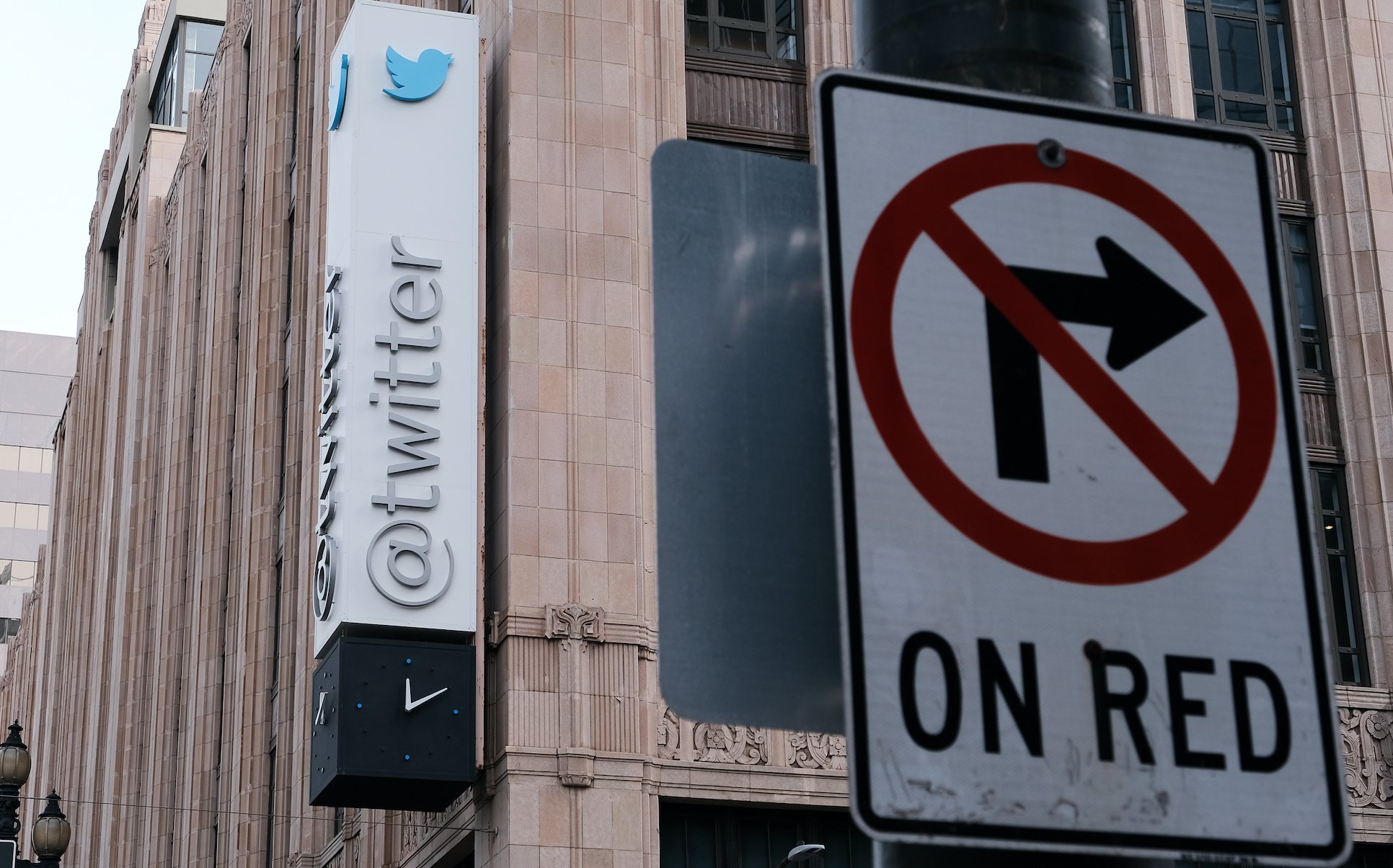 Twitter HQ with a 'no right turn on red' sign