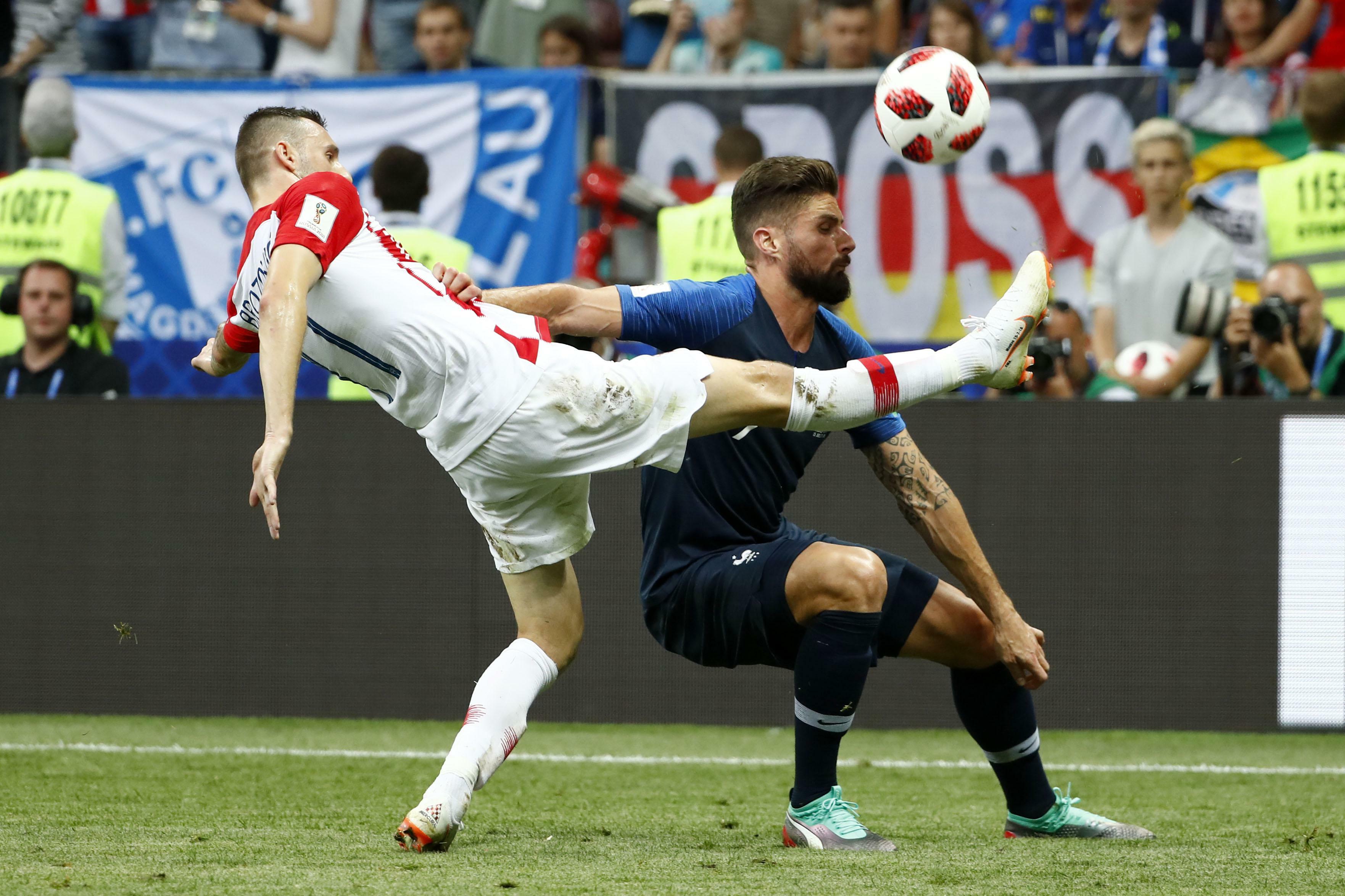 Two men playing world cup soccer