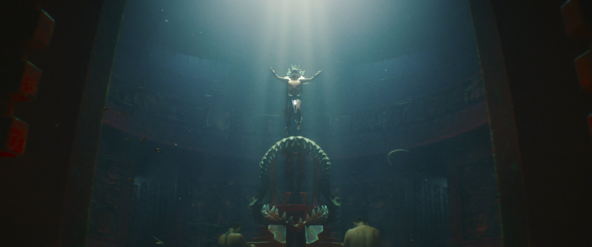 An underwater scene with a man-shaped being rising from a throne.