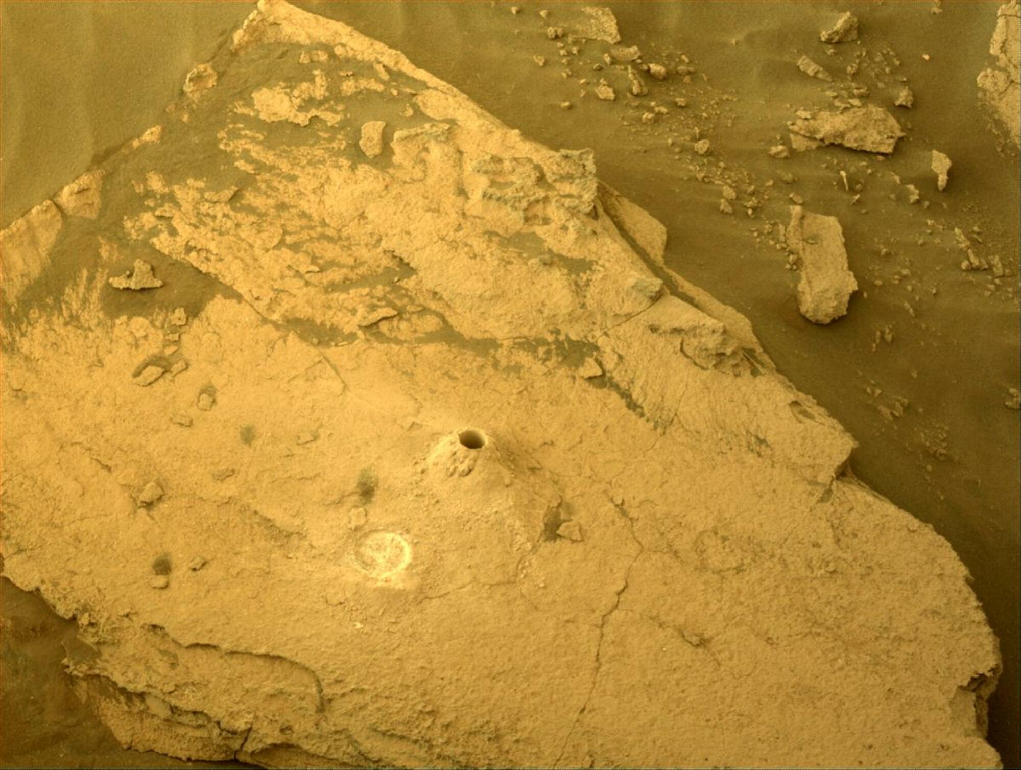 a drilled hole on the Martian ground