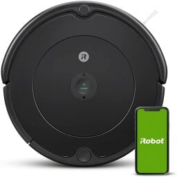 Roomba 694 with phone on iRobot app screen