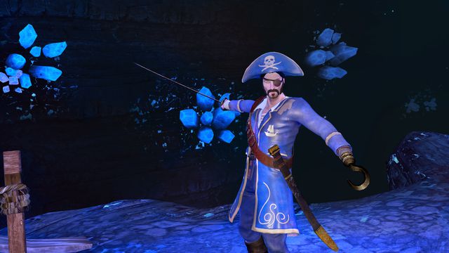 A pirate in what looks to be a dark, crystal cave, holding a sword in one hand. The other hand is a hook. He’s wearing a pirate hat, eye patch, and a blue/purple coat.