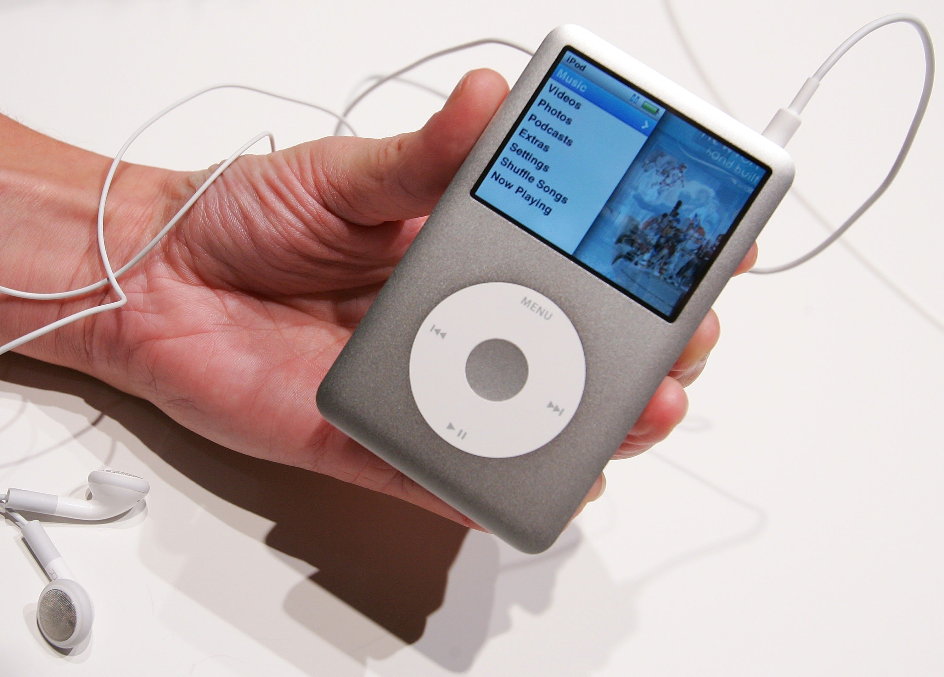 Close-up of a person holding an iPod Classic.
