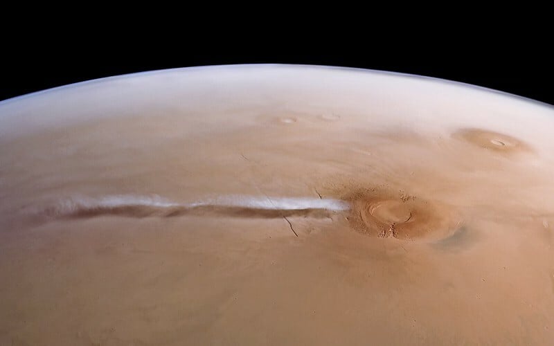 An extremely long cloud hovering to the west of Arsia Mons on Mars