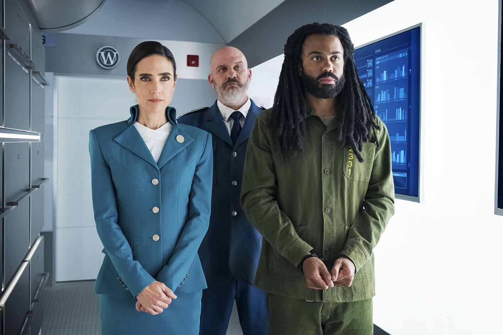 Daveed Diggs in handcuffs alongside Jennifer Connelly and Mike O'Malley
