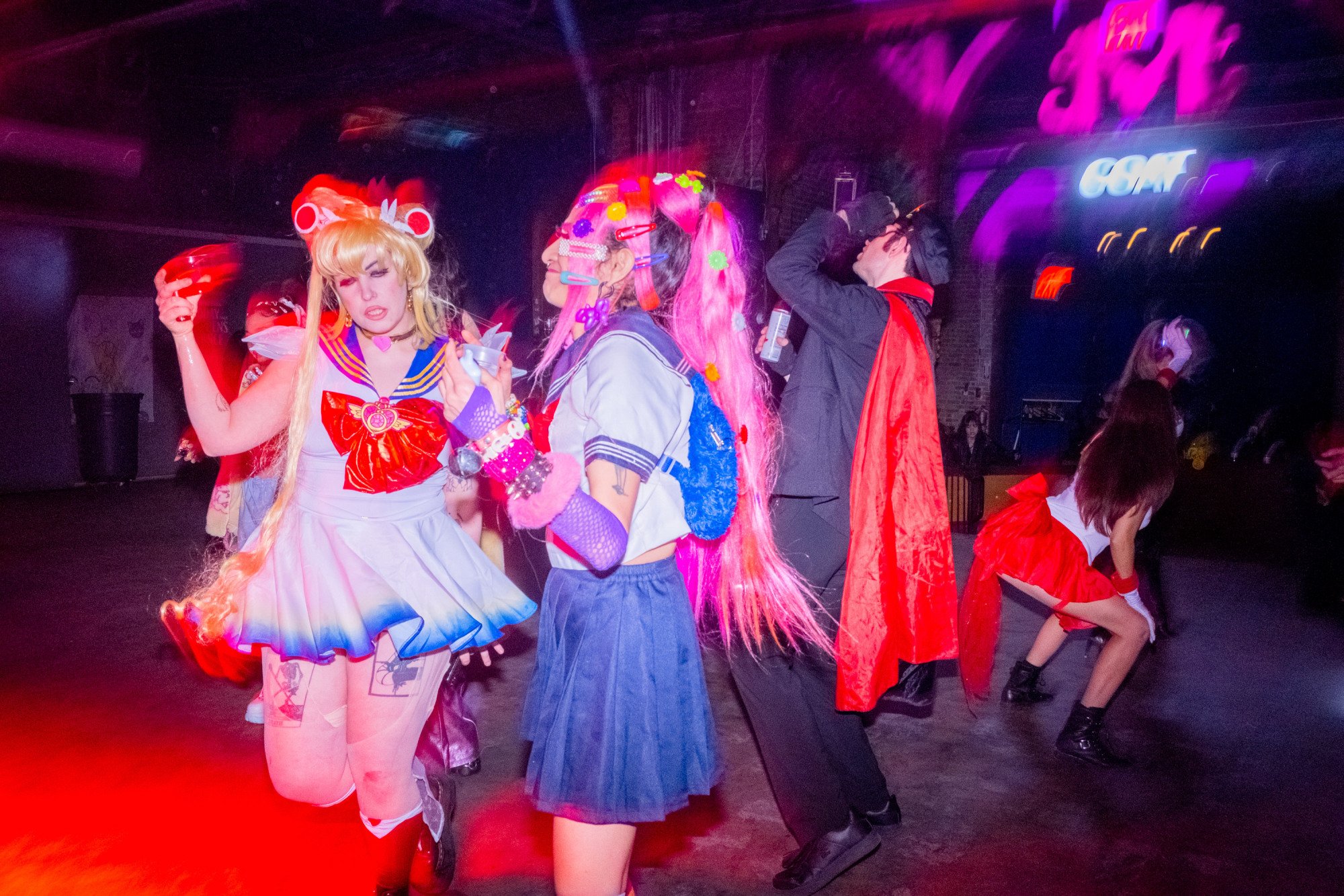Two individuals dancing in Sailor Moon costumes